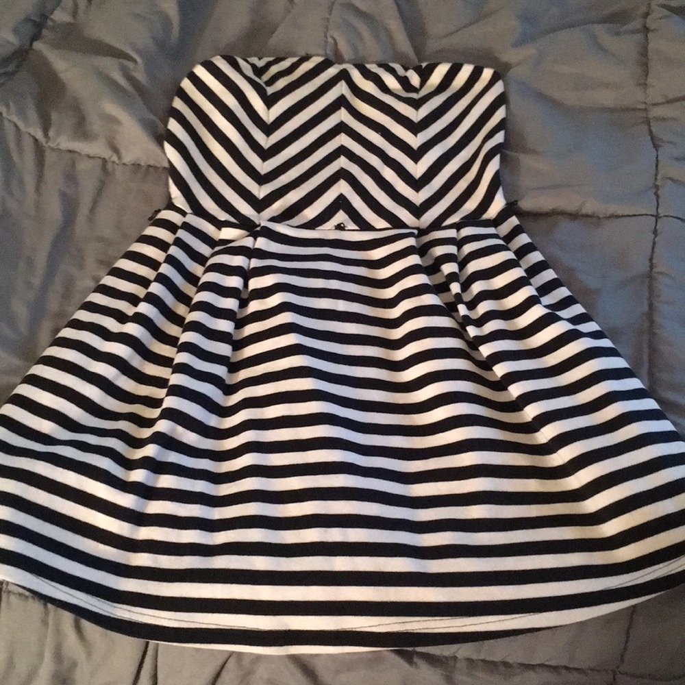 Very short strapless black and white striped dress